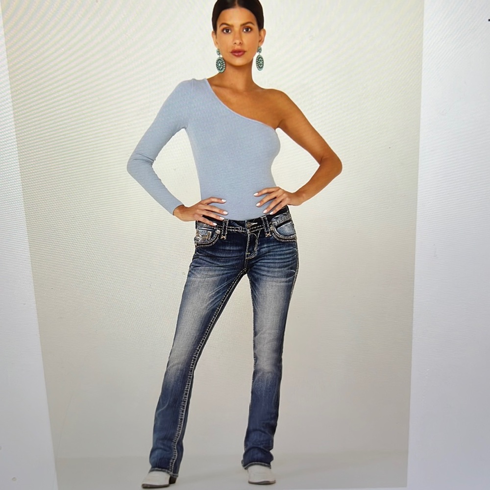 Rock Revival medium wash bootcut jeans with rhinestone pockets